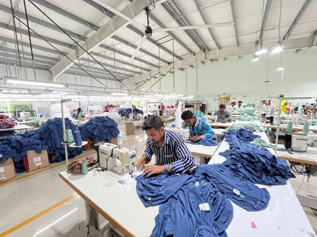 Inside view of a clothing manufacturing unit clothing production house in India showing sewing lines