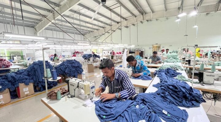 Inside view of a clothing manufacturing unit clothing production house in India showing sewing lines